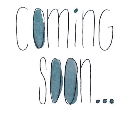 Text 'Coming soon' with blue ink blotches on a white background